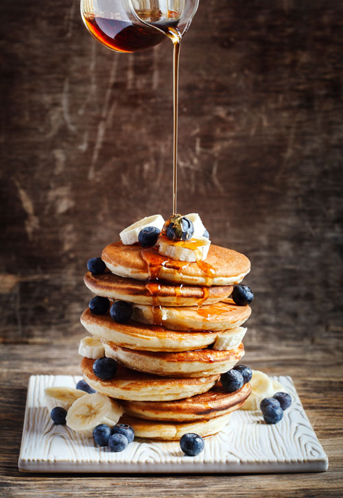 Pancakes-with-banana-blueberry-and-maple-syrup-for-a-breakfast