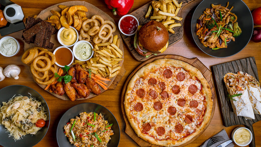 Assorted-set- from-pizza-Pepperoni- Assorted-snacks- burger-wok-and-rice-top-view