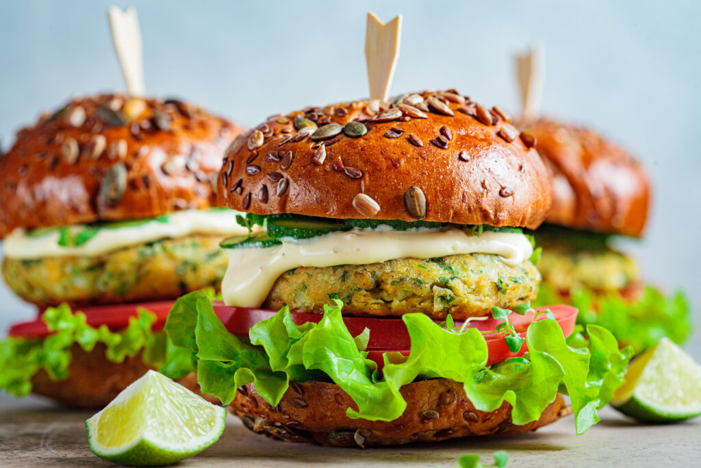 vegan-falafel-burger-with-vegetables-and-sauce-dark-background-healthy-food