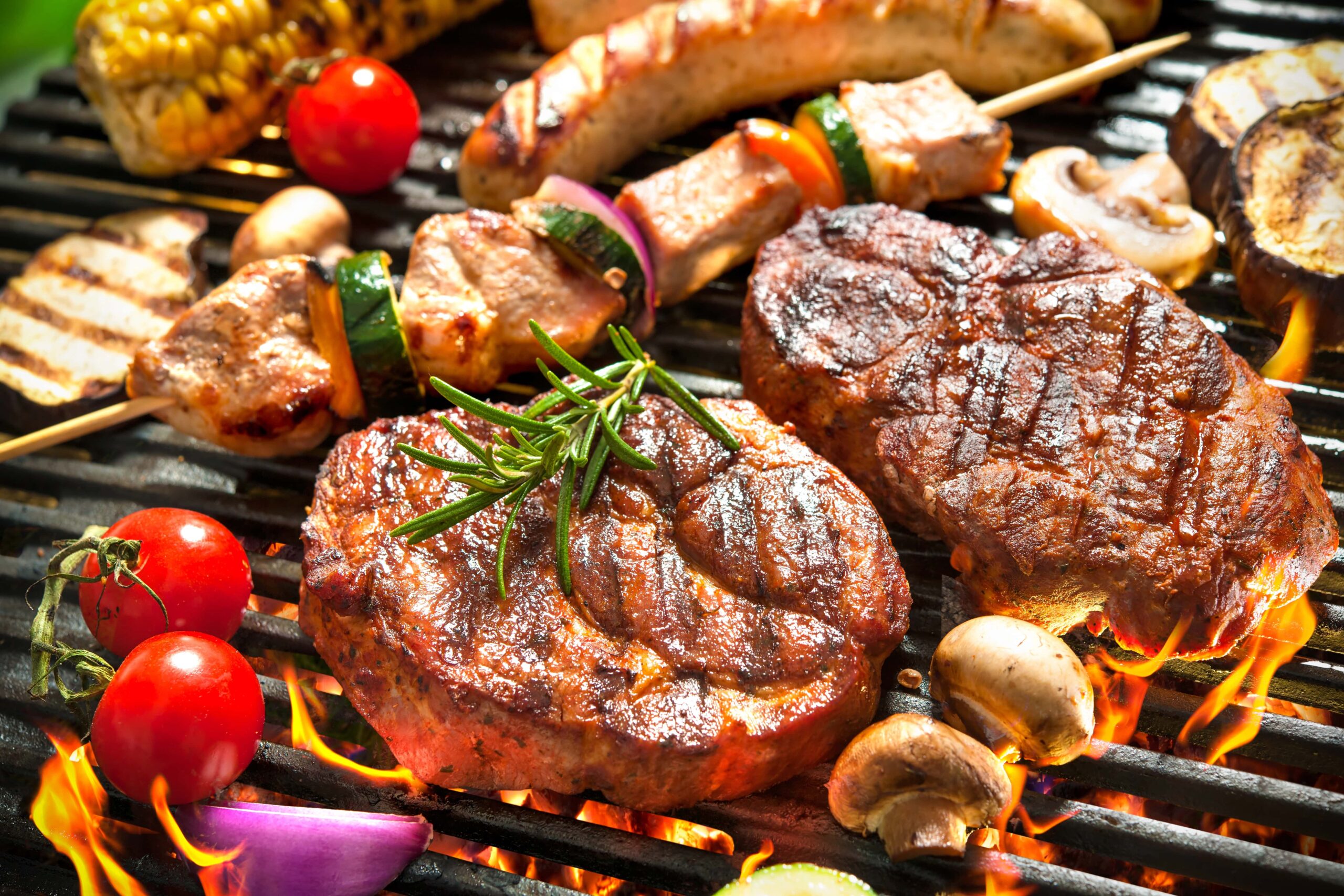 Meat, veggies, and mushrooms on grill